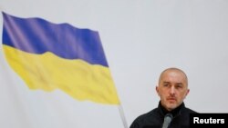 Председатель Национального банка Украины Андрей Пышный выступает во время презентации банкноты, посвященной первой годовщине вторжения России в Украину, Киев, Украина, 23 февраля 2023 года