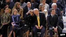 President Emmanuel Macron's wife Brigitte Macron (CL) talks with US President-elect Donald Trump (CR) as they sit alongside daughter of US President Joe Biden, Ashley Biden (L), First Lady of the United States Jill Biden (2L) and French President Emmanuel